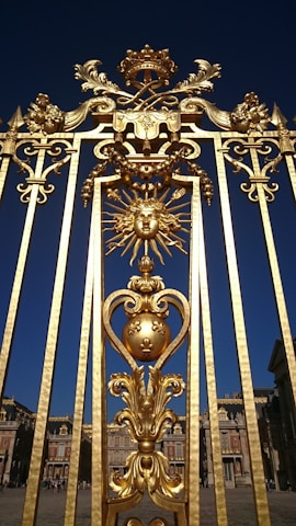 A majestic dark blue themed website layout featuring the gates of Olympus with intricate details.