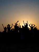 a group of people raising their hands