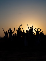 a group of people raising their hands
