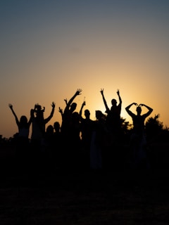 a group of people raising their hands
