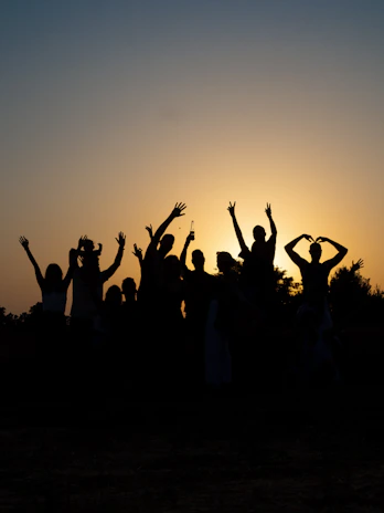 a group of people raising their hands
