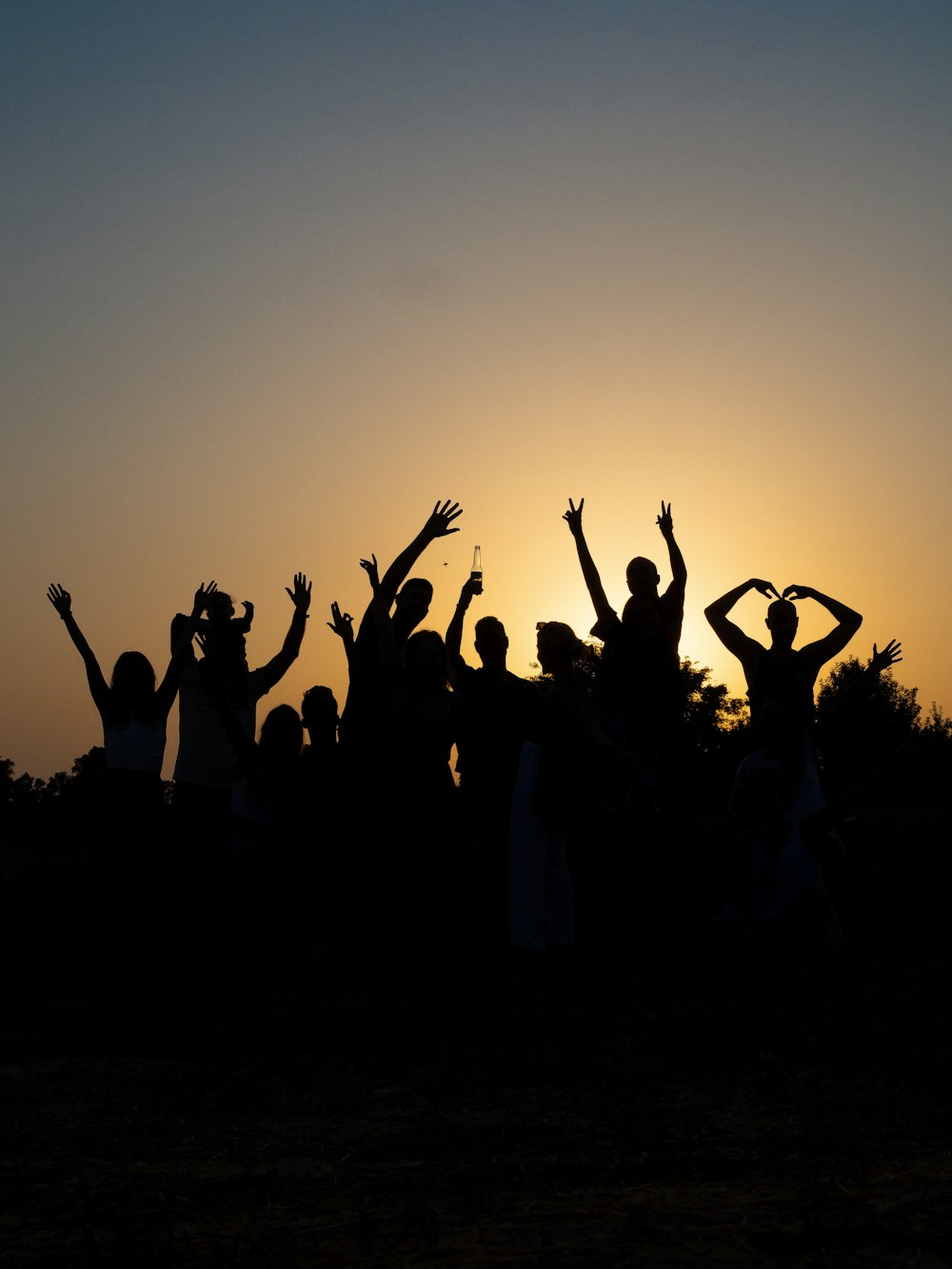a group of people raising their hands