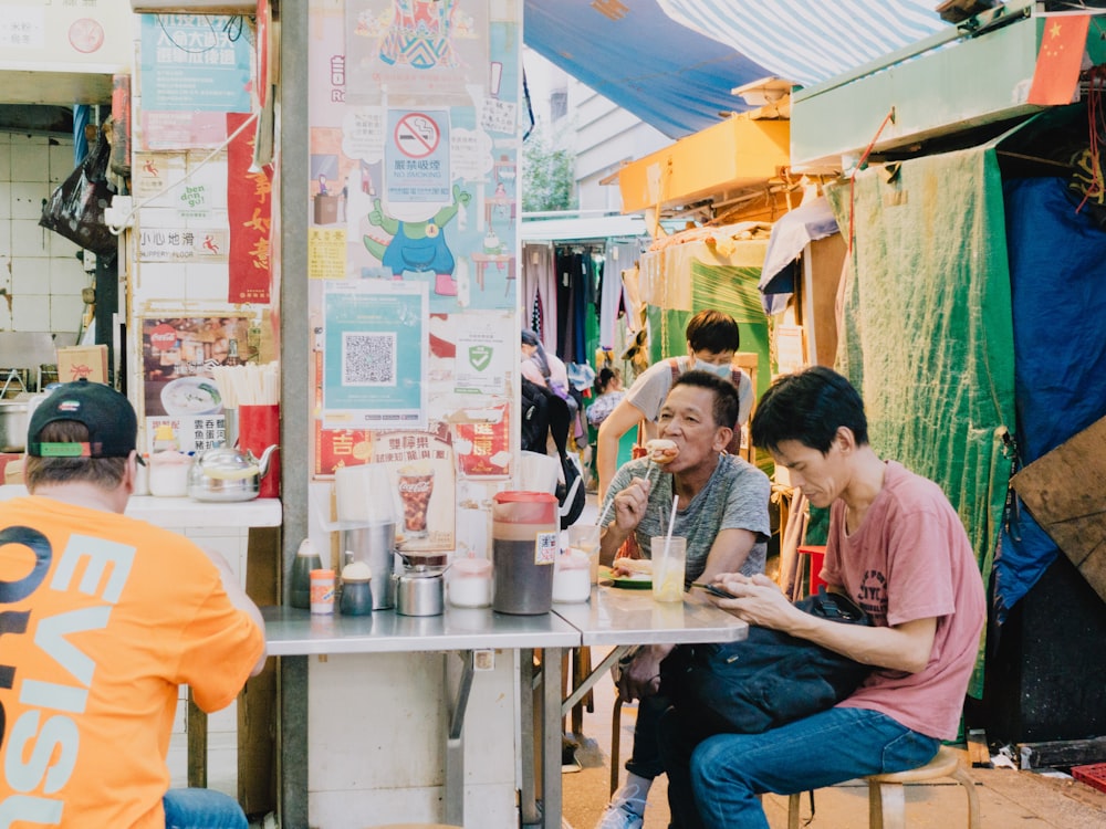 a group of people sitting at a table