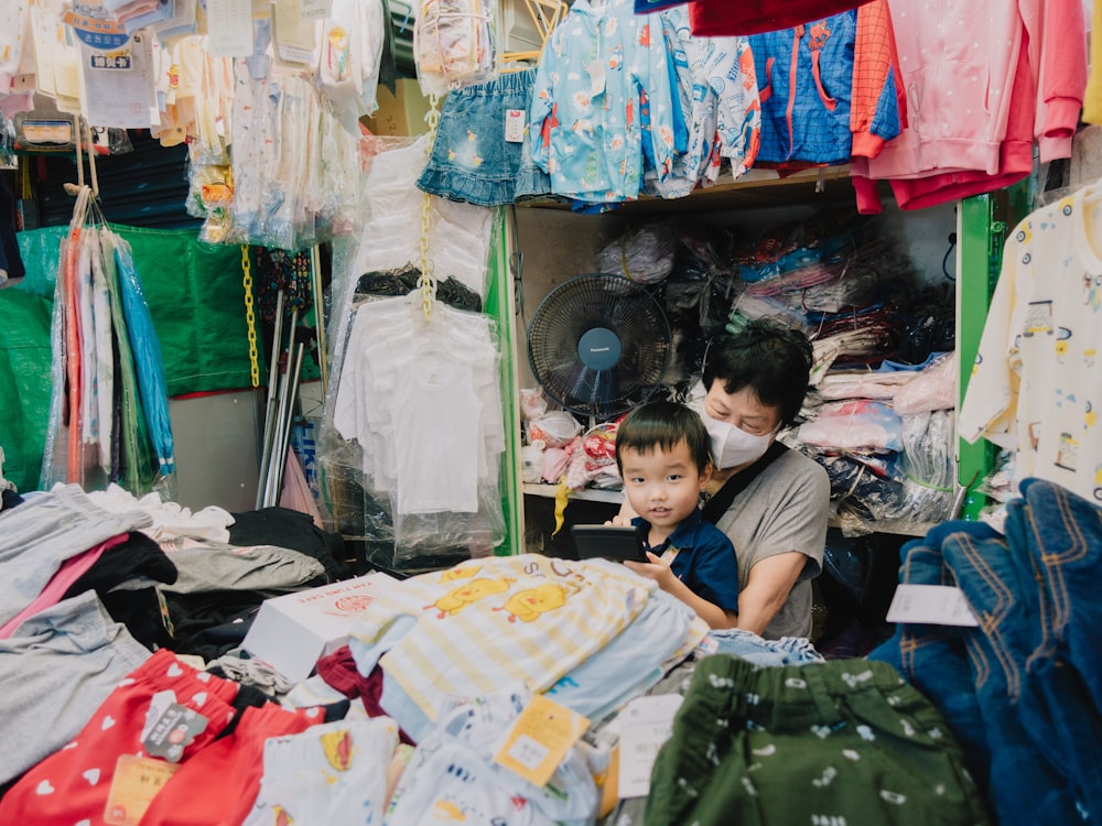 a couple of boys in a clothing store