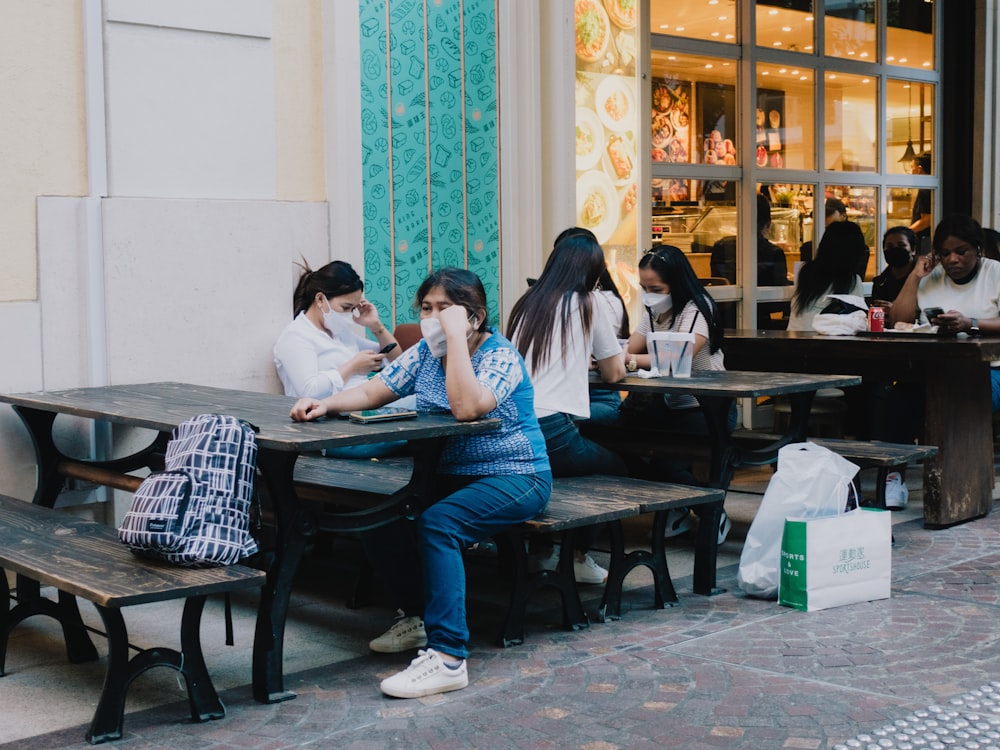 a group of people sitting at tables