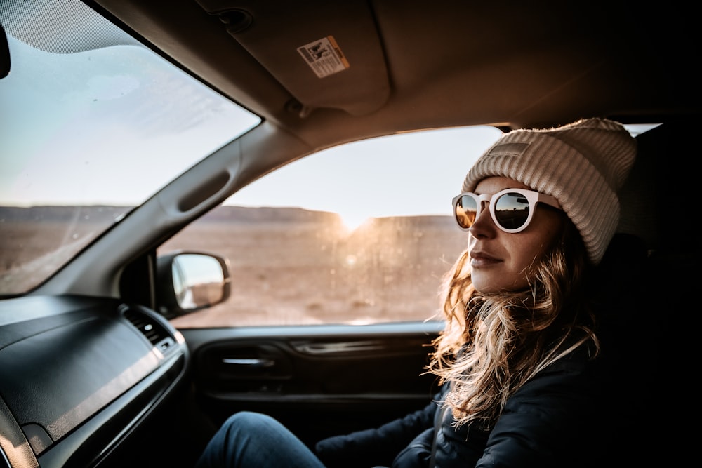 a person wearing sunglasses and a hat