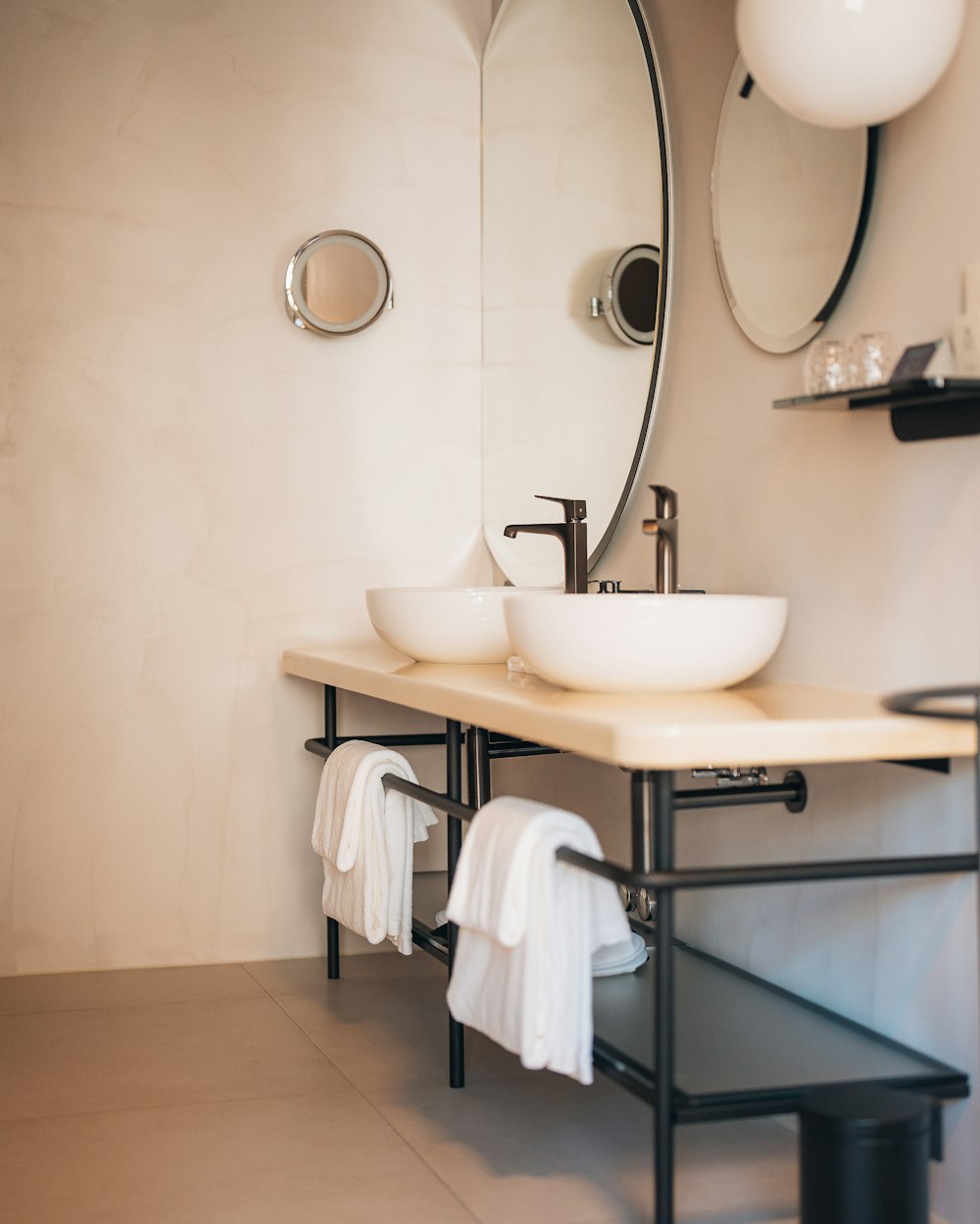 a bathroom with a sink and mirrors