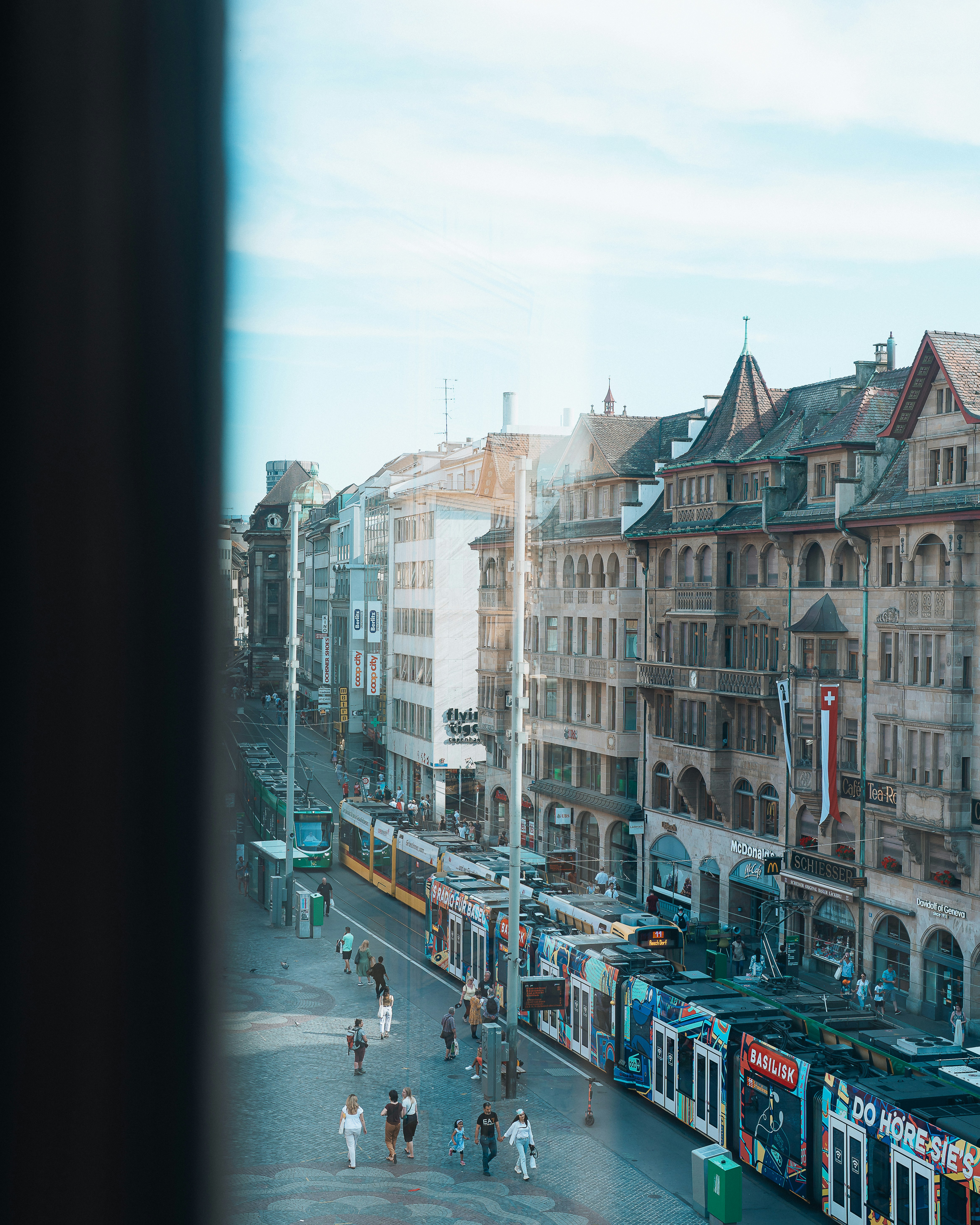 a city street with people and buildings
