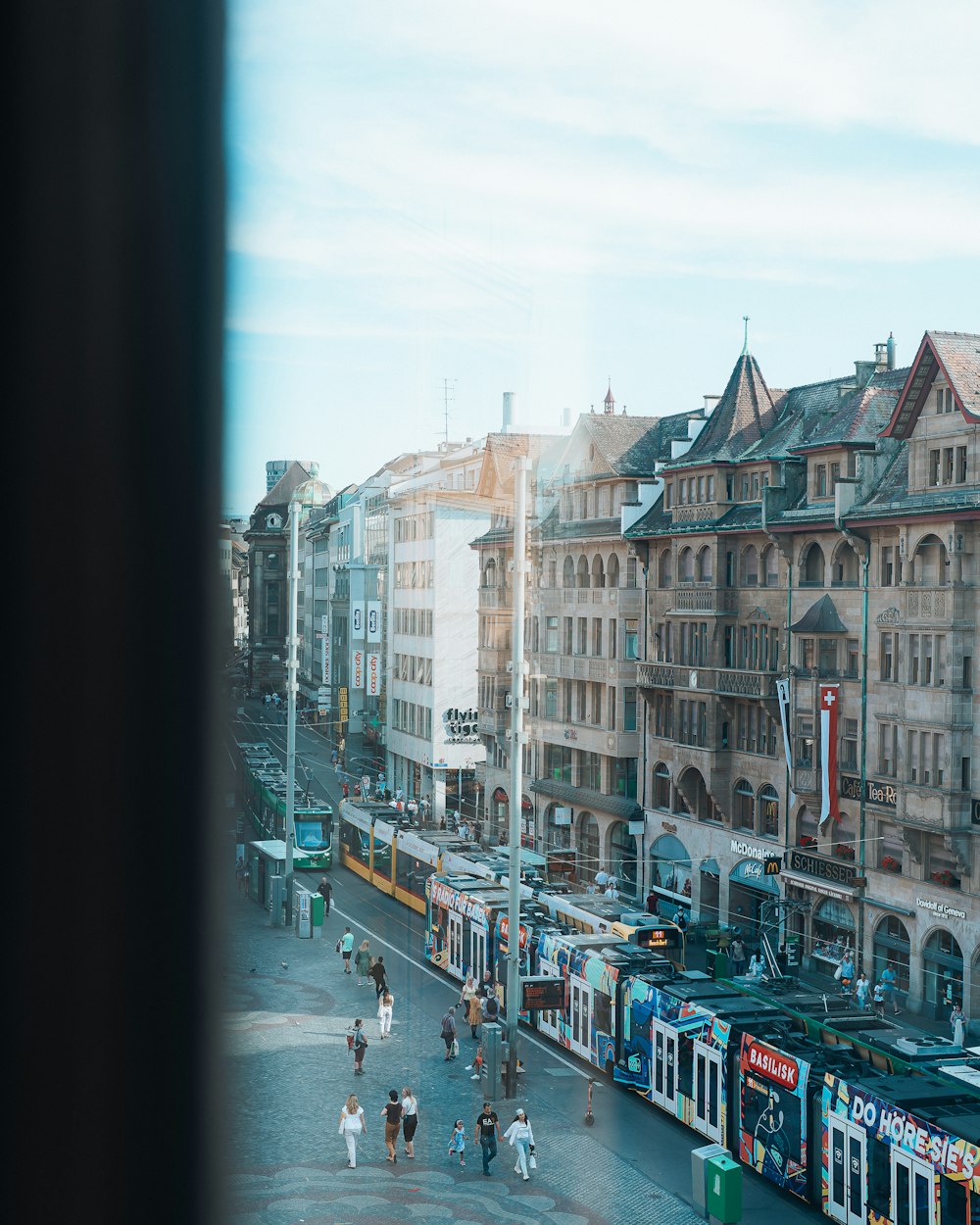 a city street with people and buildings