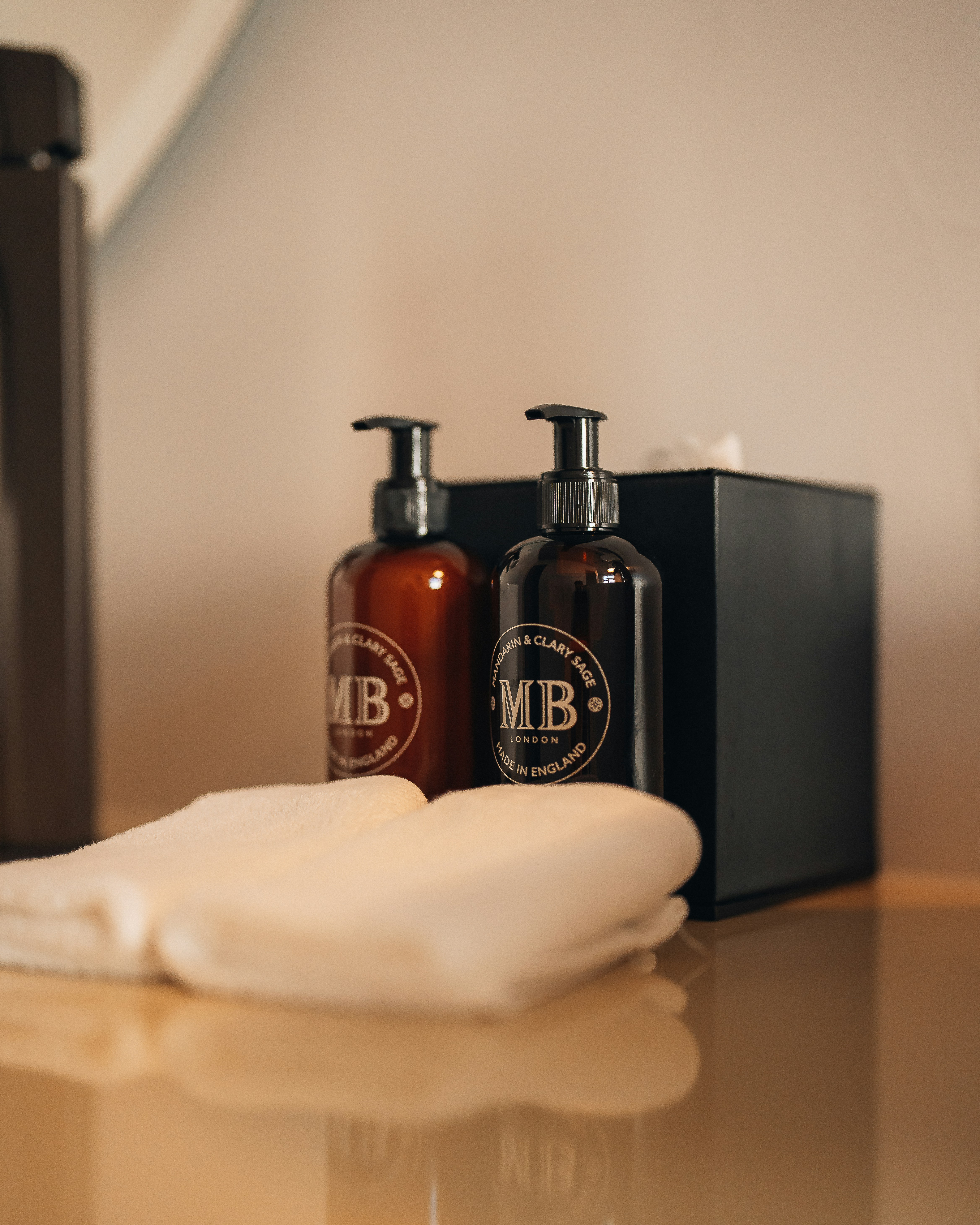 a bottle of liquor next to a box of cigarettes