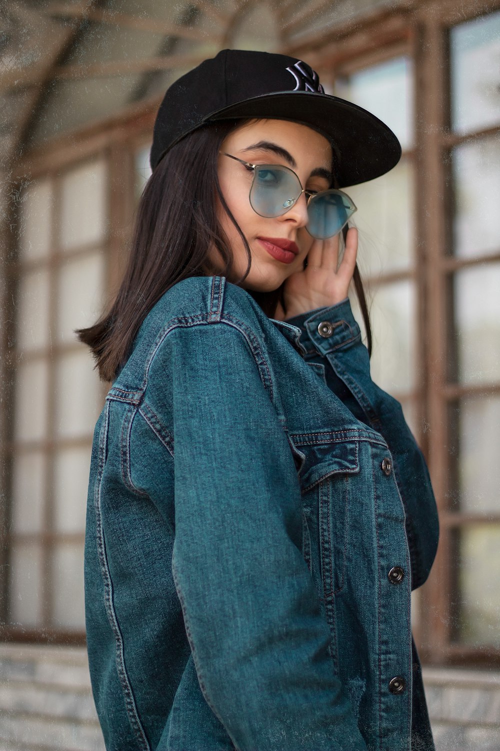 a person wearing a hat and glasses