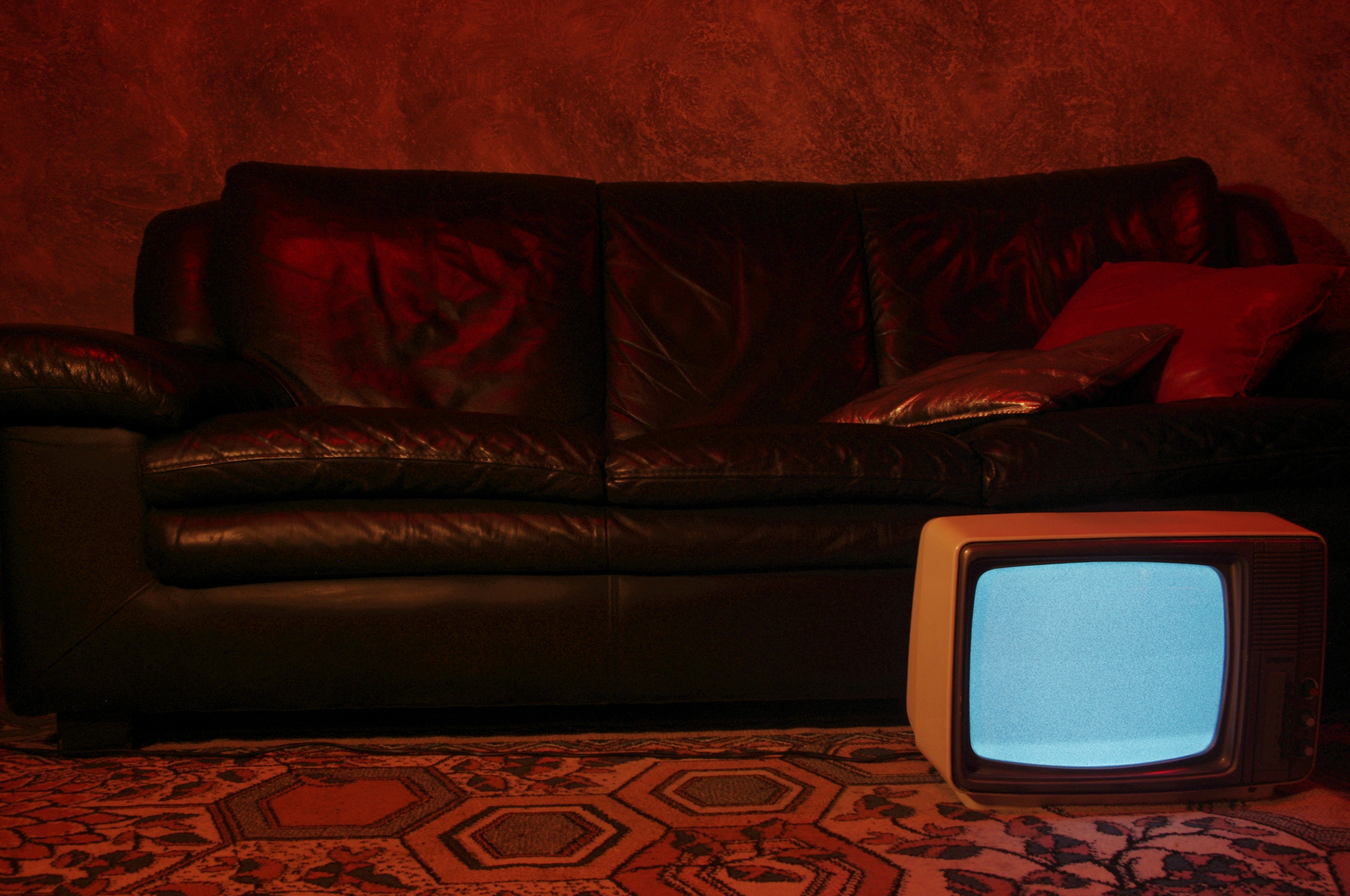 Cozy living room with HD TV, Fire TV Stick, and person relaxing