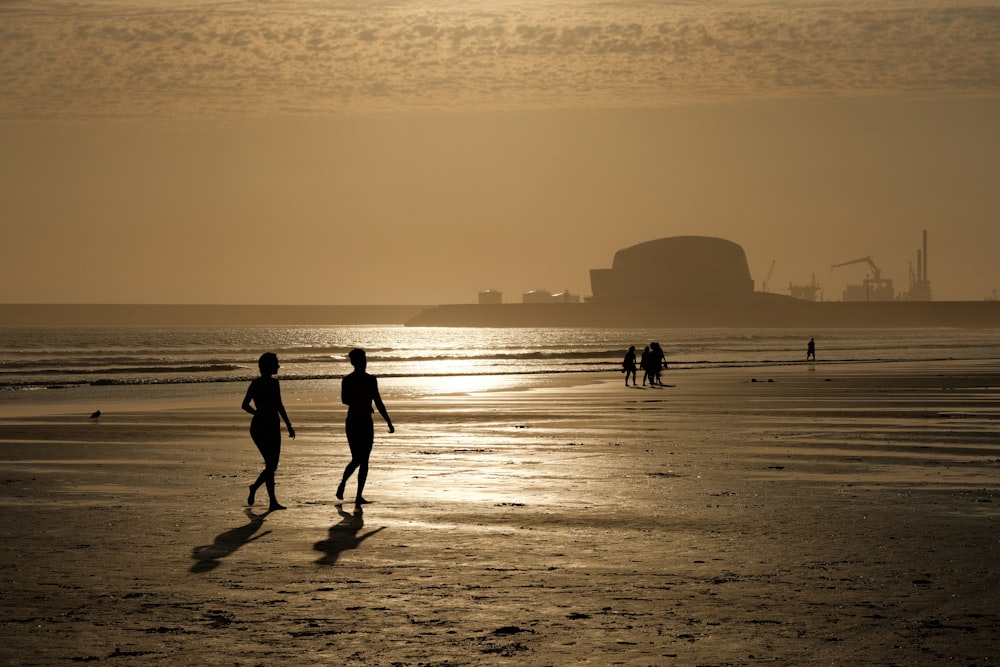 people walking on a beach