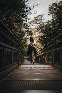a man riding a skateboard on a bridge