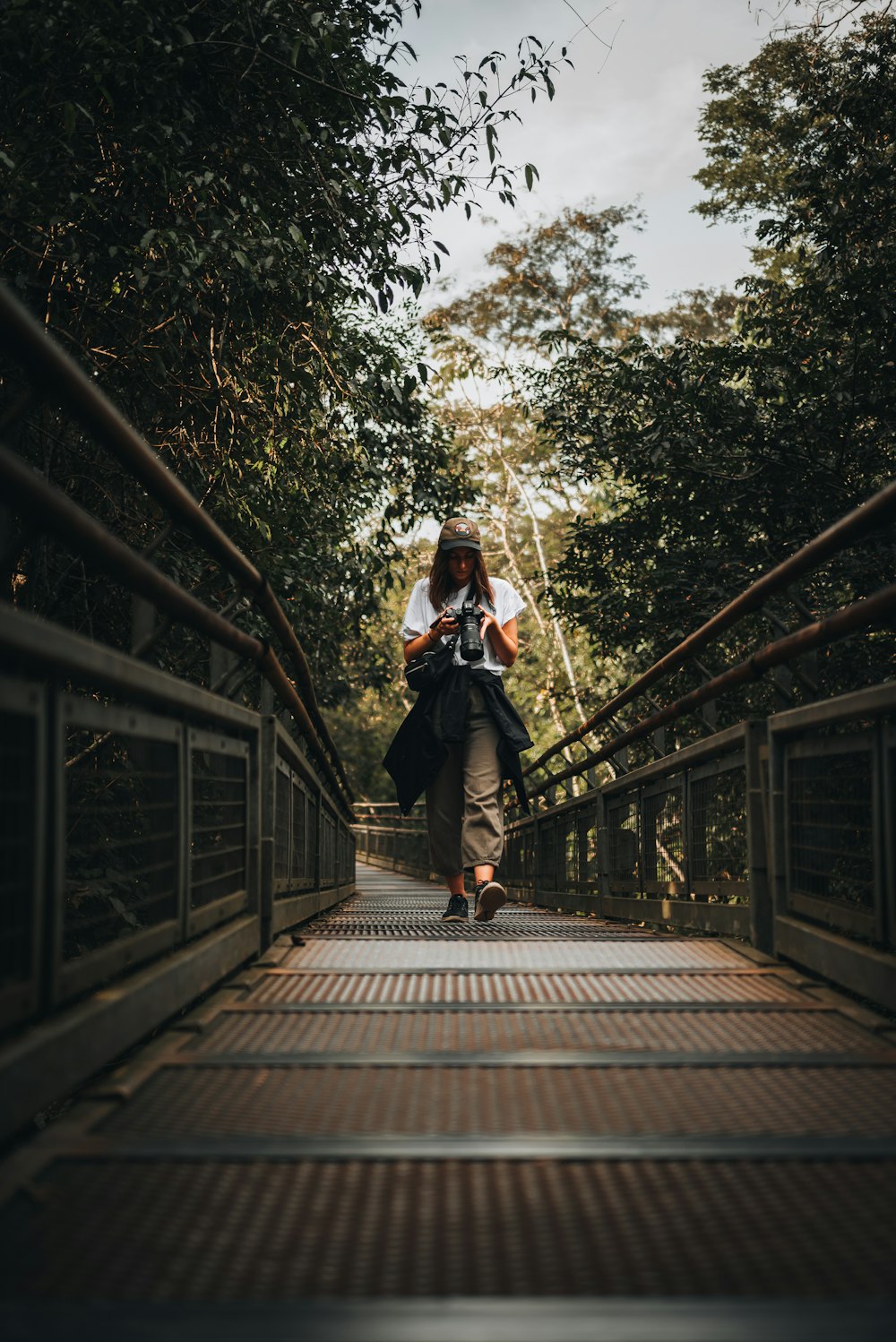 a man riding a skateboard on a bridge