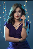 A model confidently posing in soft natural light with a lilac backdrop.