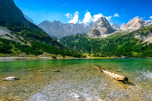 a lake with mountains in the background