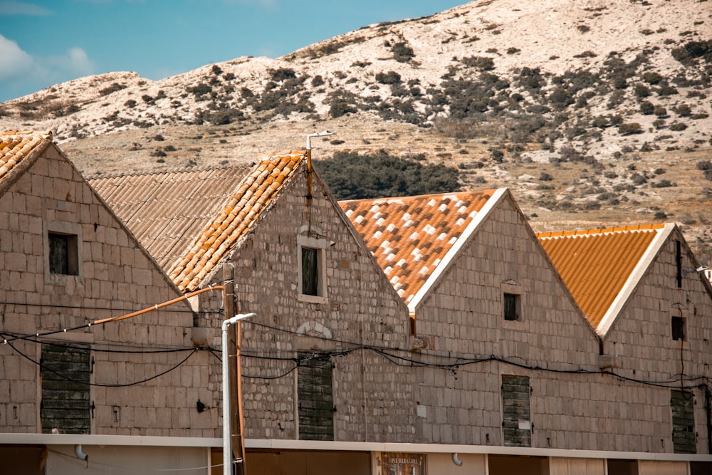 a building with a mountain in the background