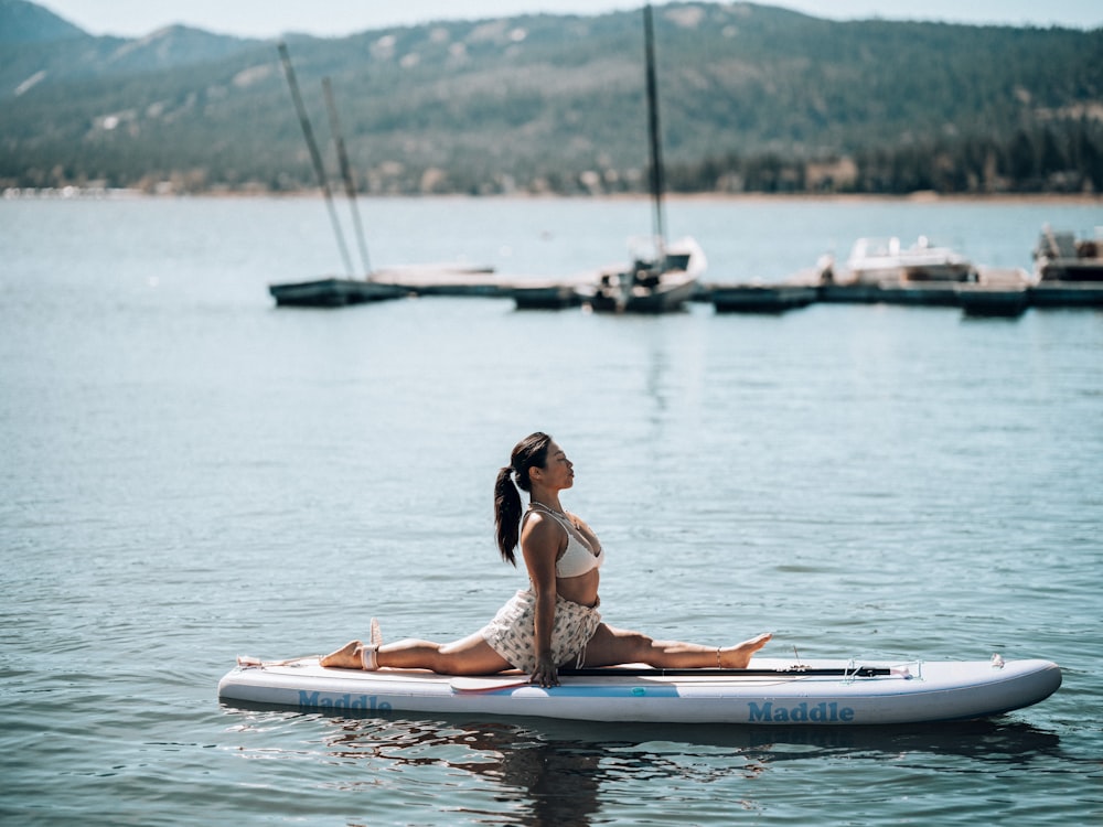 a person sitting on a paddle boat