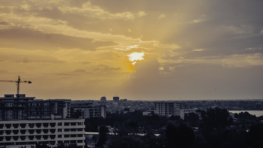 a city with buildings and a crane