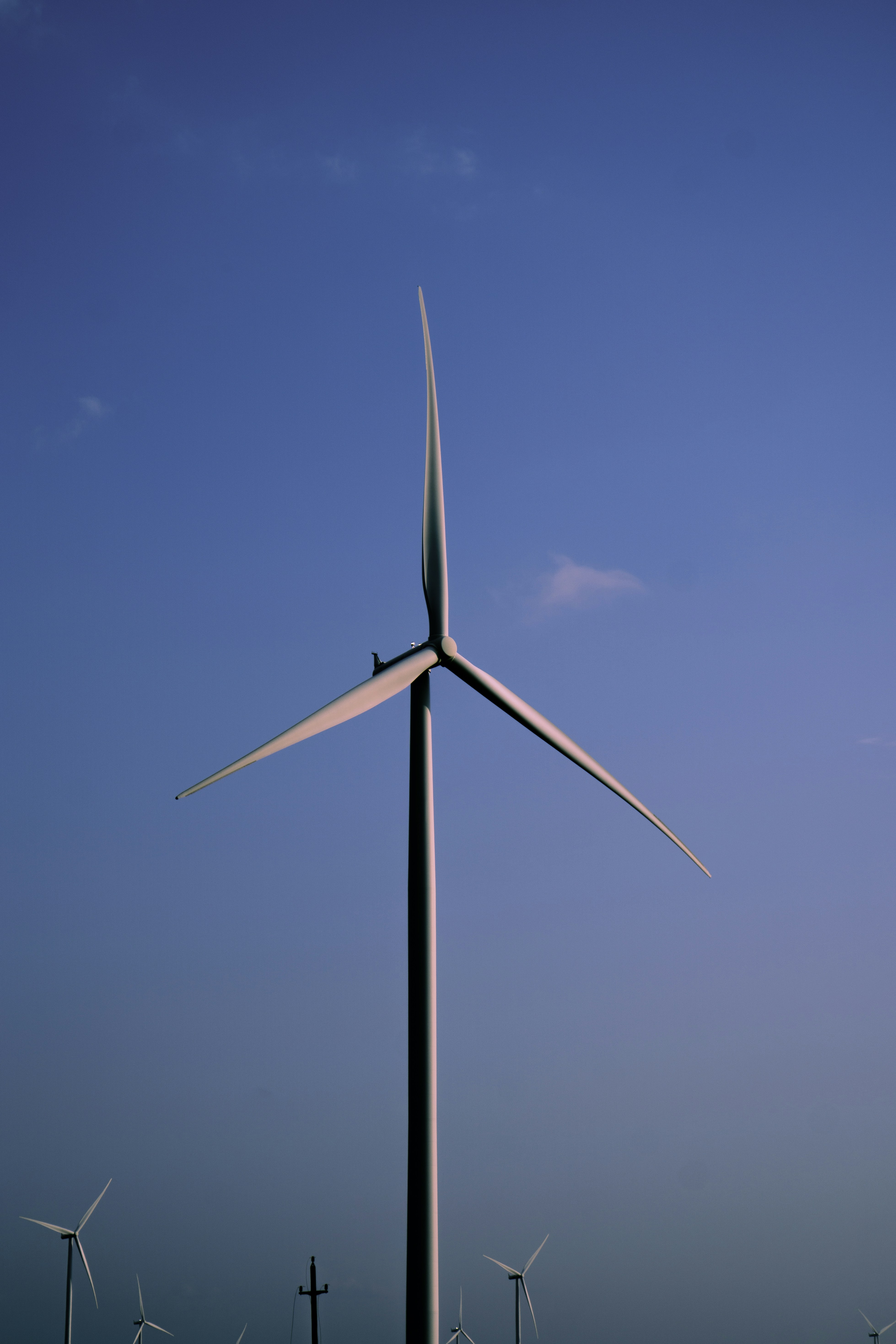 a windmill with a blue sky