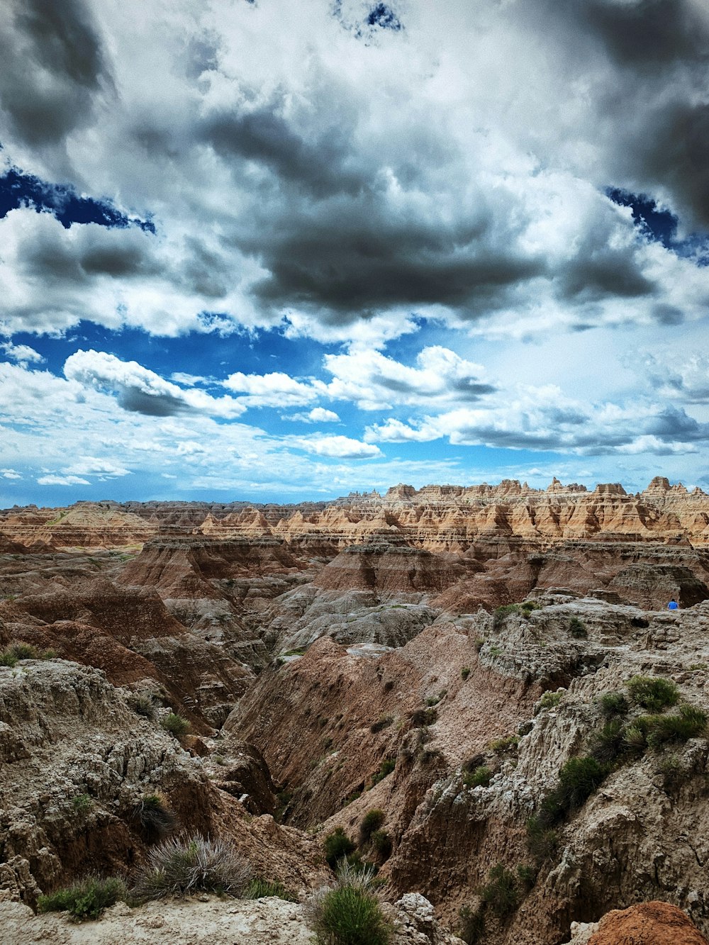 a rocky canyon with clouds