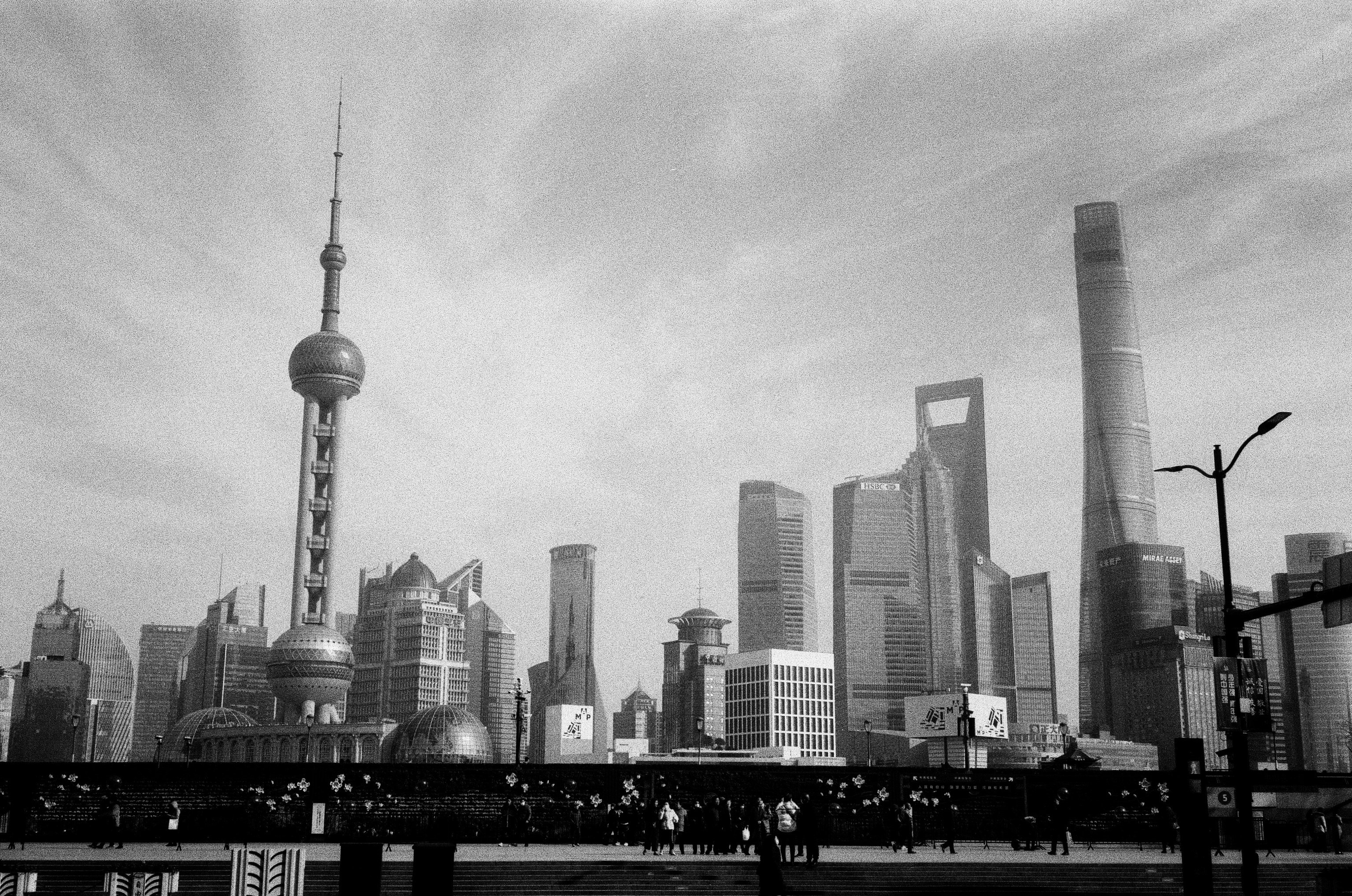 a city skyline with a large tower