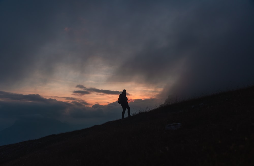 a person standing on a hill