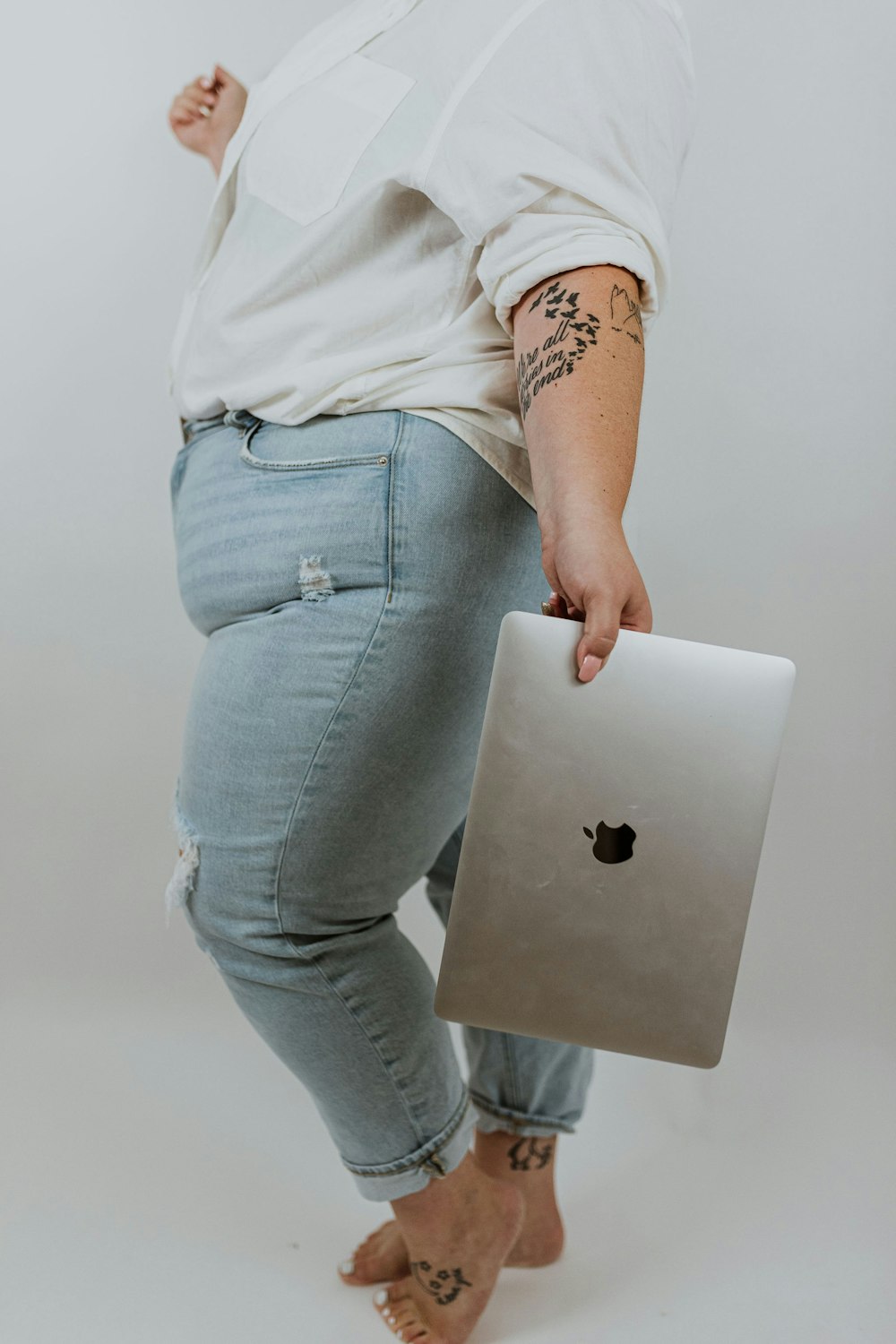 a person holding a laptop