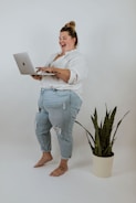 a man holding a laptop
