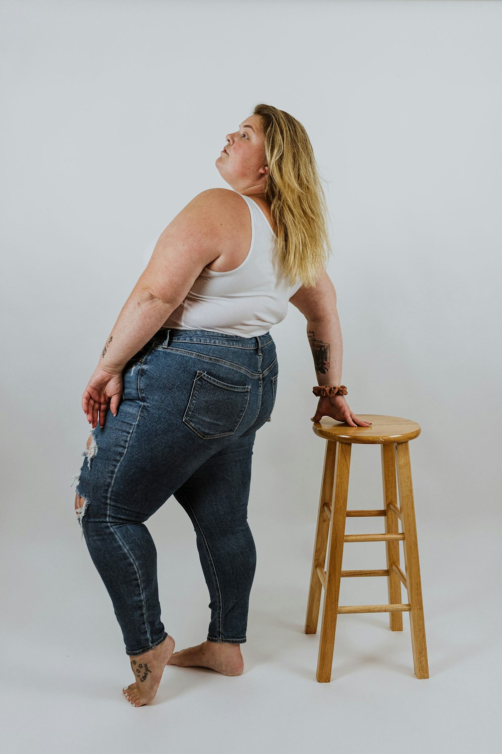 a person standing on a stool