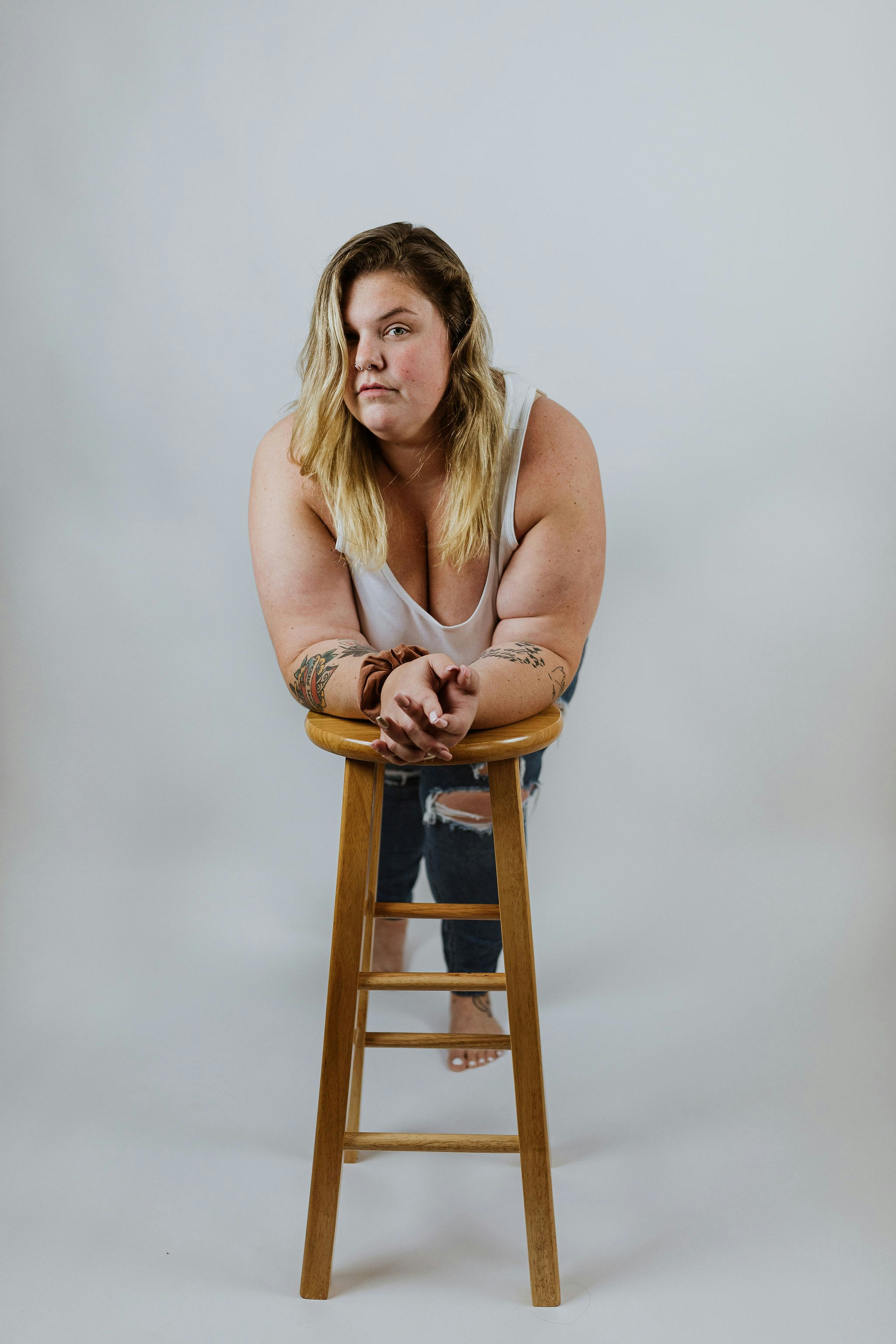 a person sitting on a stool