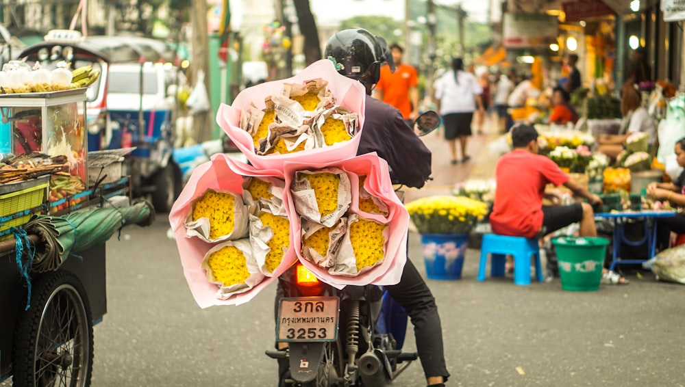 a person carrying a large pink bag of food