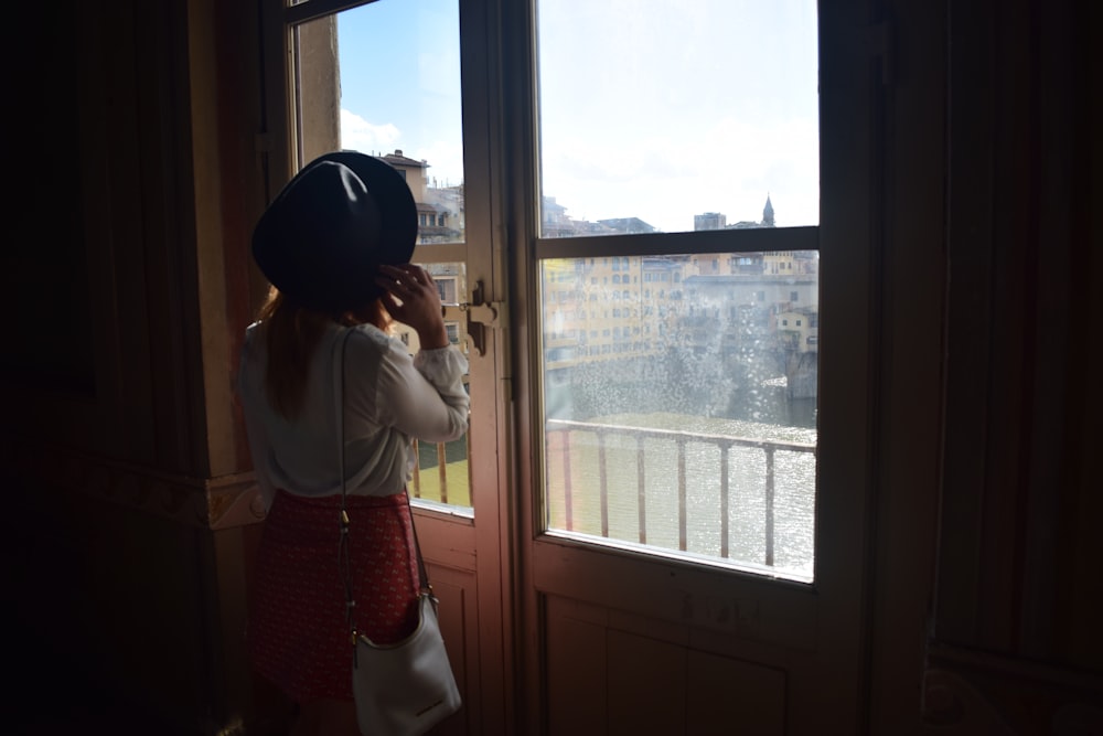 a girl looking out a window