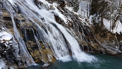 The waterfall frozen where it drops through the middle of Bad Gastein