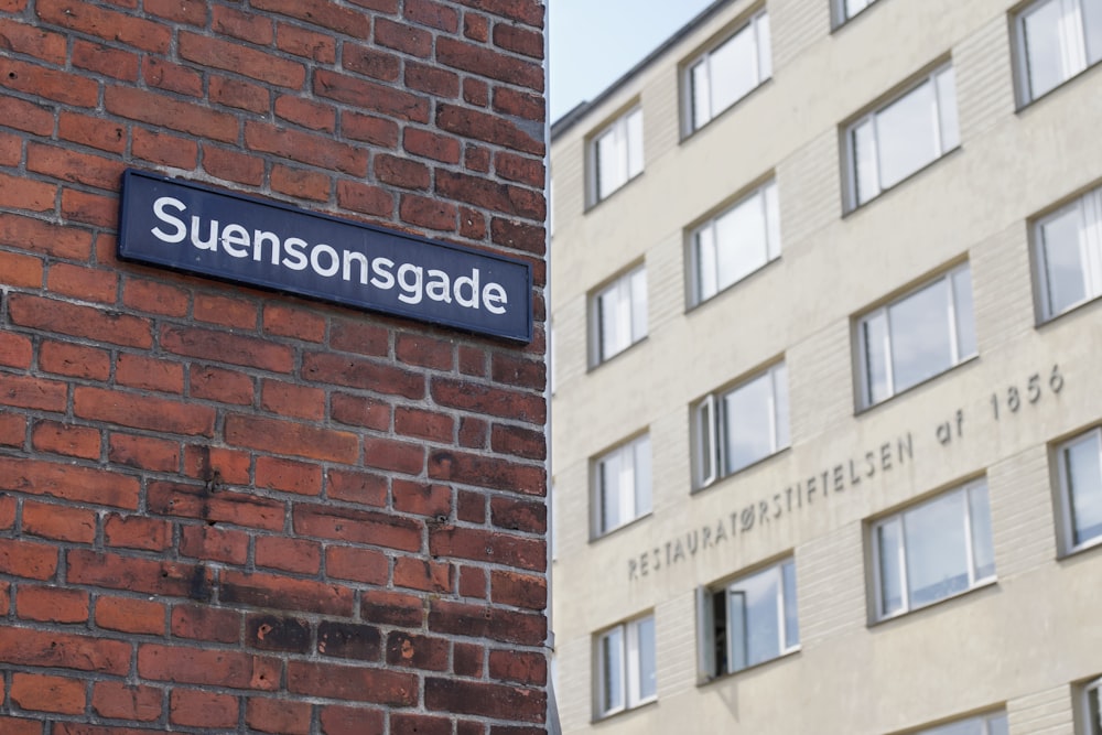 a street sign on a brick building