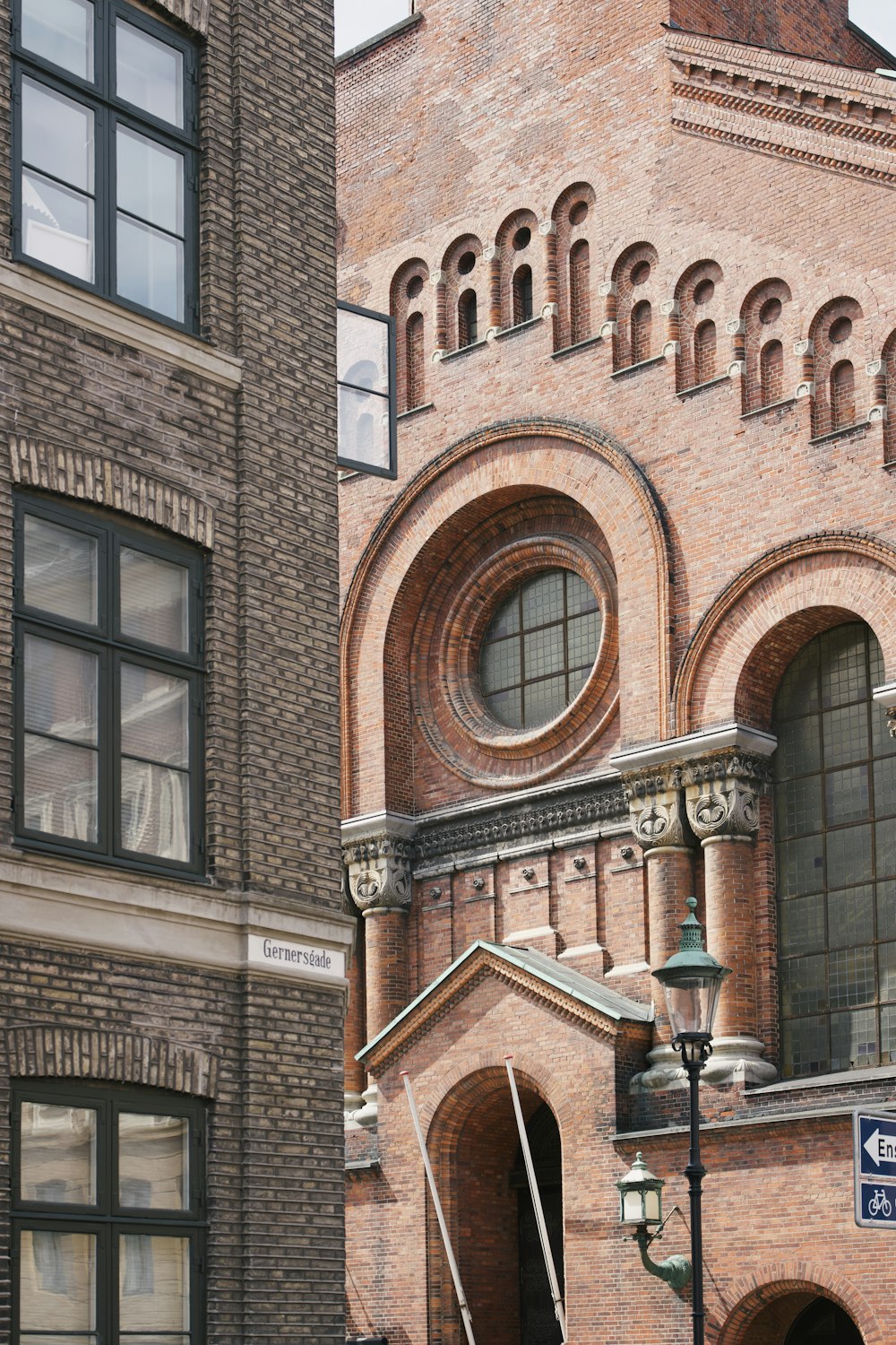 a brick building with a large arched window