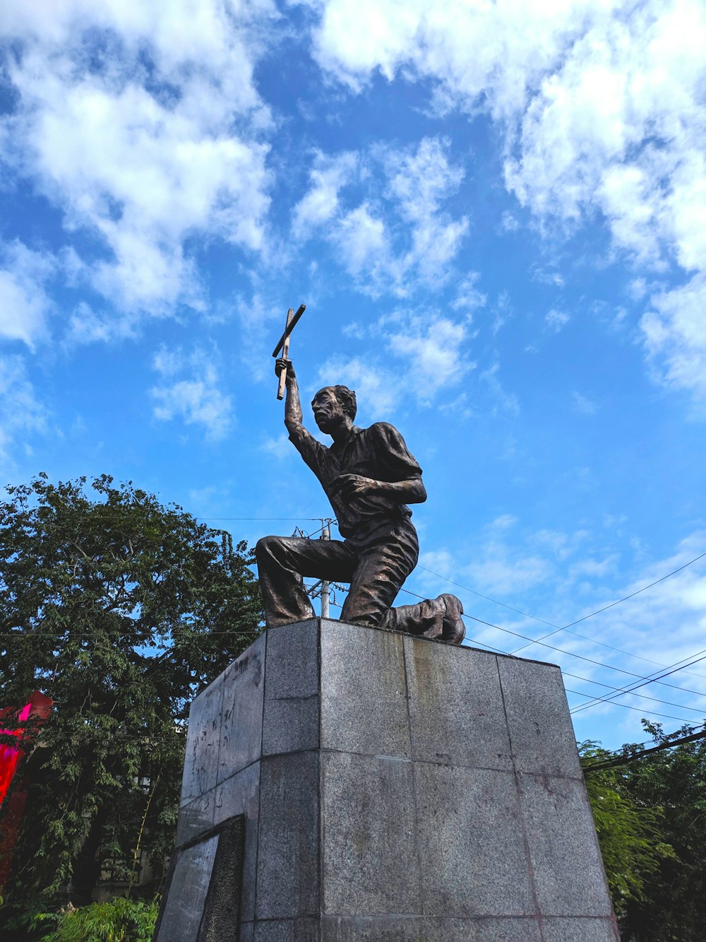 a statue of a man holding a sword