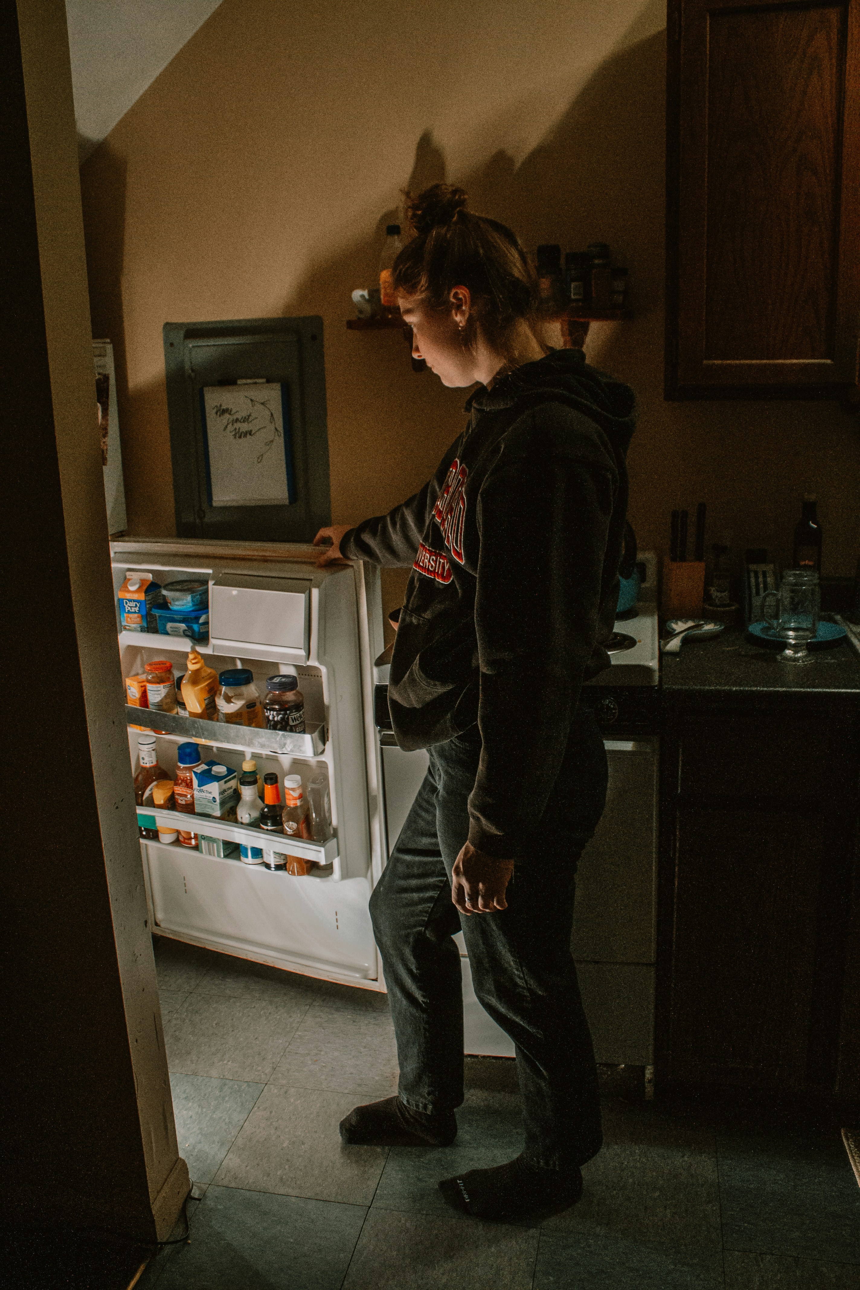 woman wearing yellow long-sleeved dress under white clouds and blue sky during daytime
