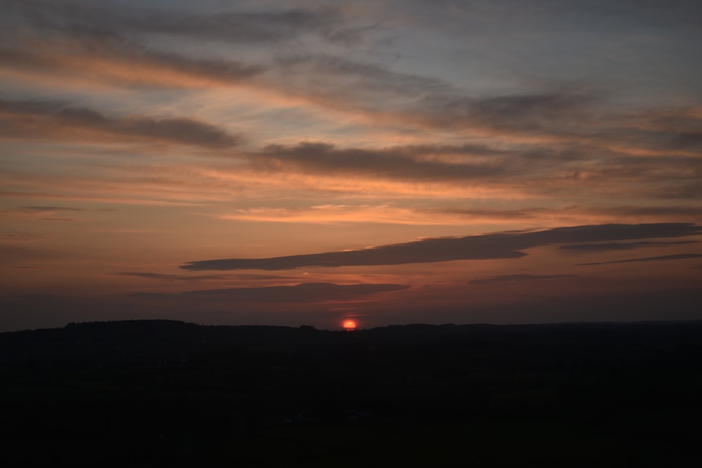 a sunset over a landscape