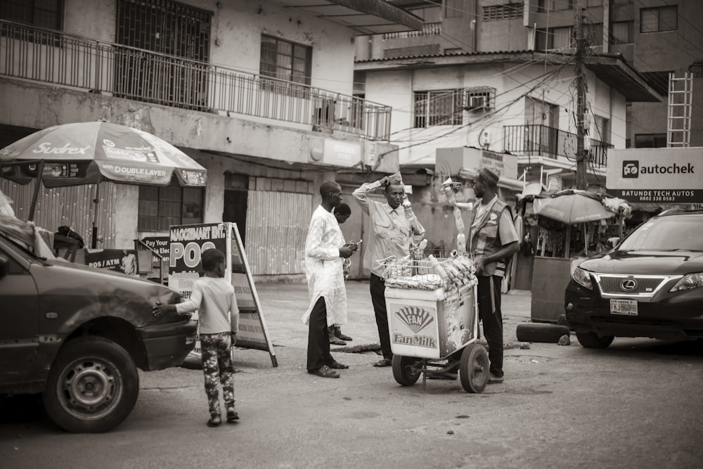 a group of people stand outside a shop