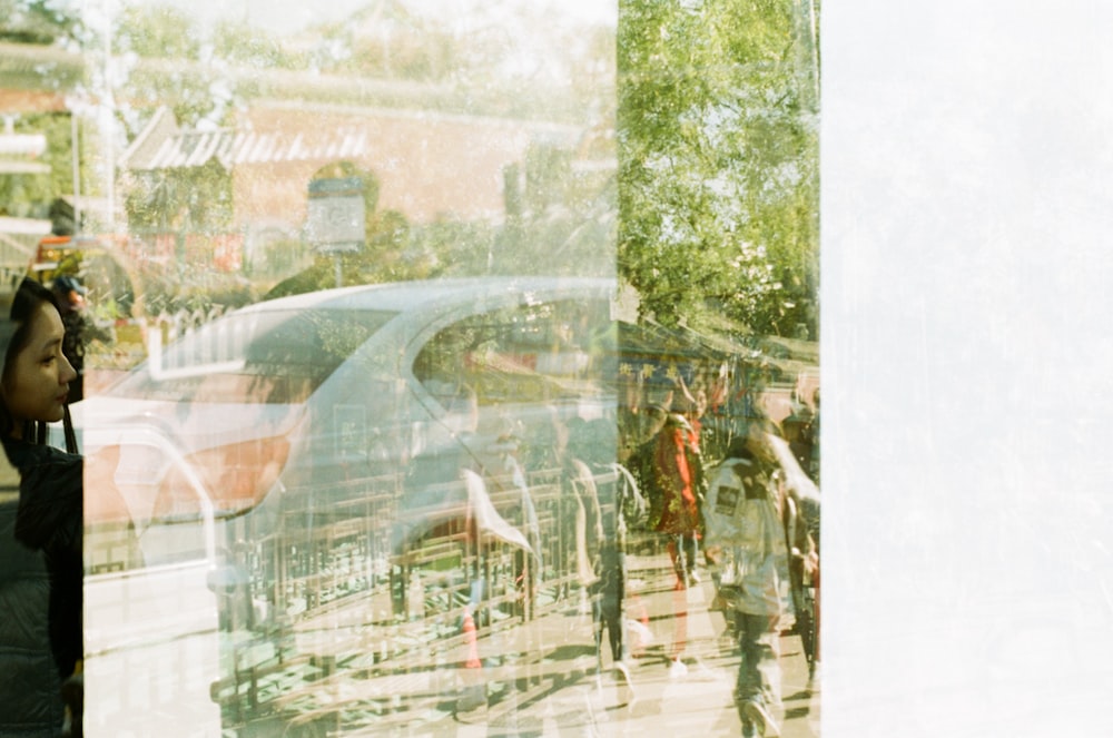 a reflection of a group of people in a window