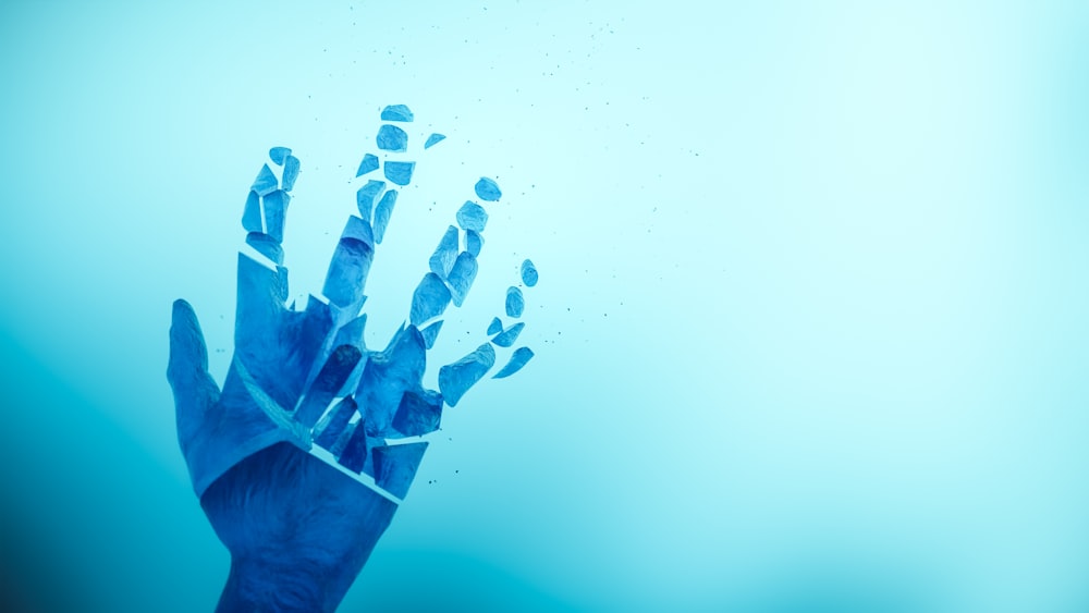 a hand with a blue background