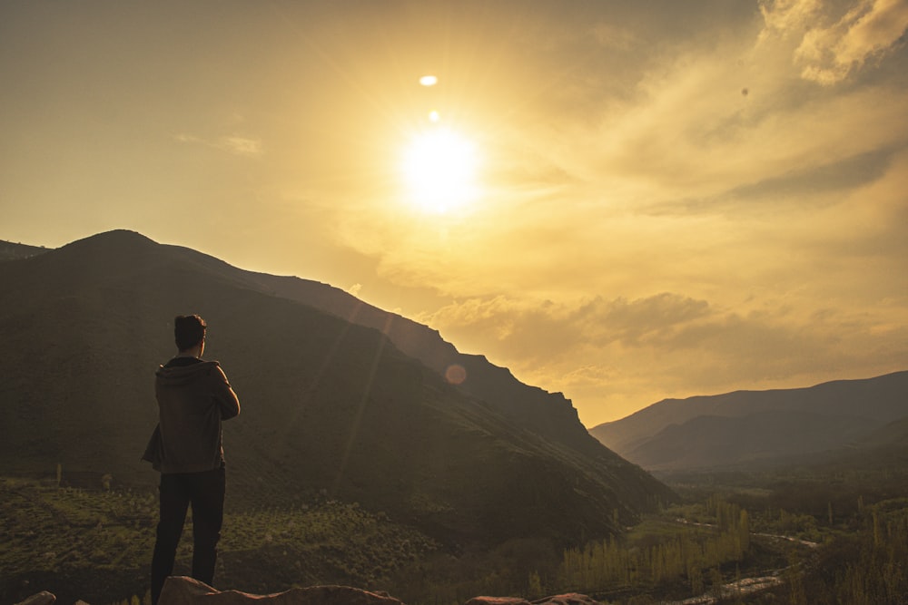 a man standing on a hill