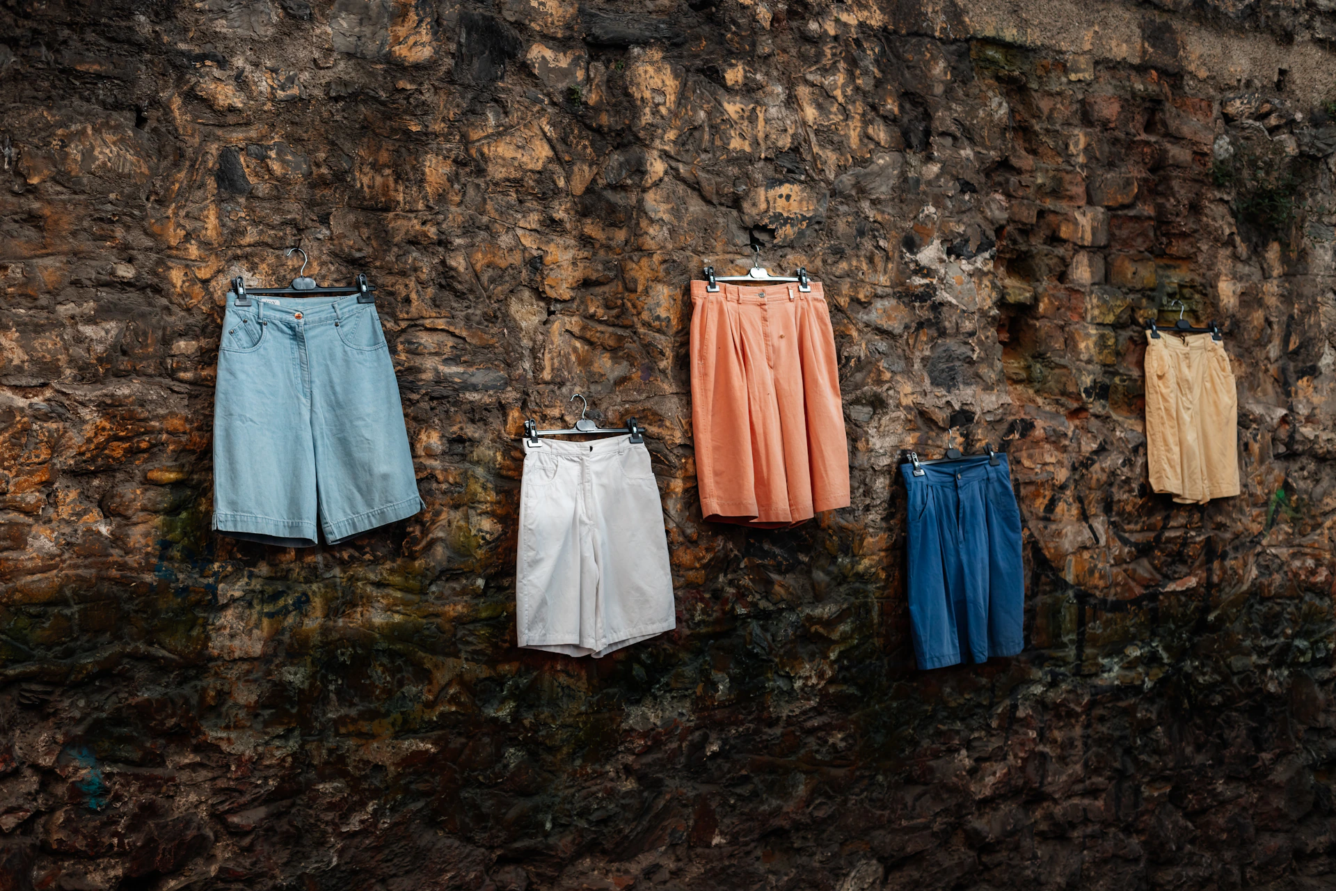 a group of clothes on a wall