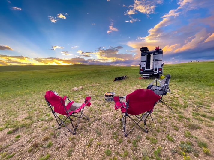 two chairs and a camera on a field