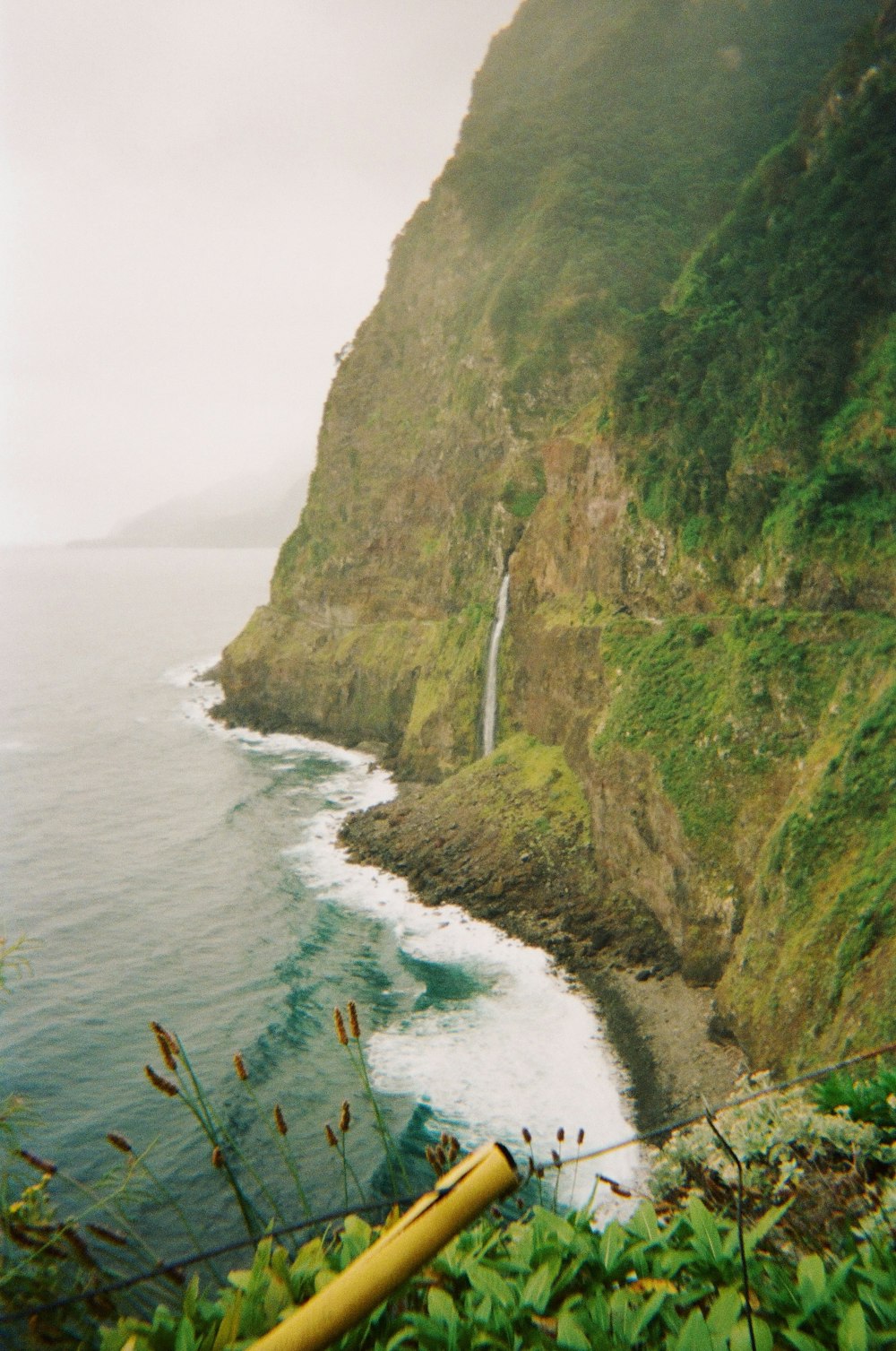 a waterfall on a cliff