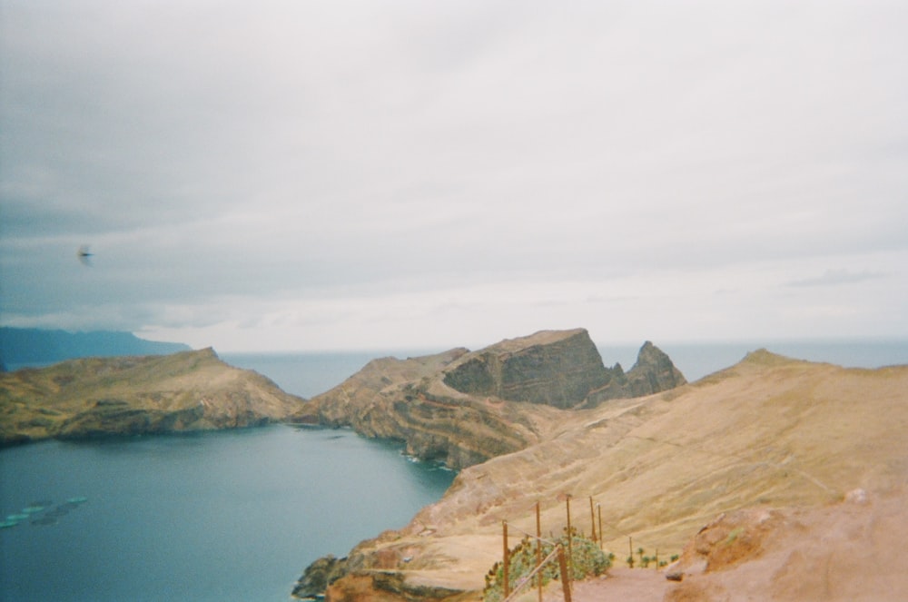 a body of water with hills around it