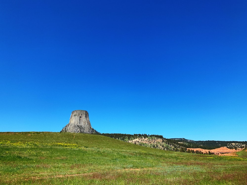 a stone structure in a field