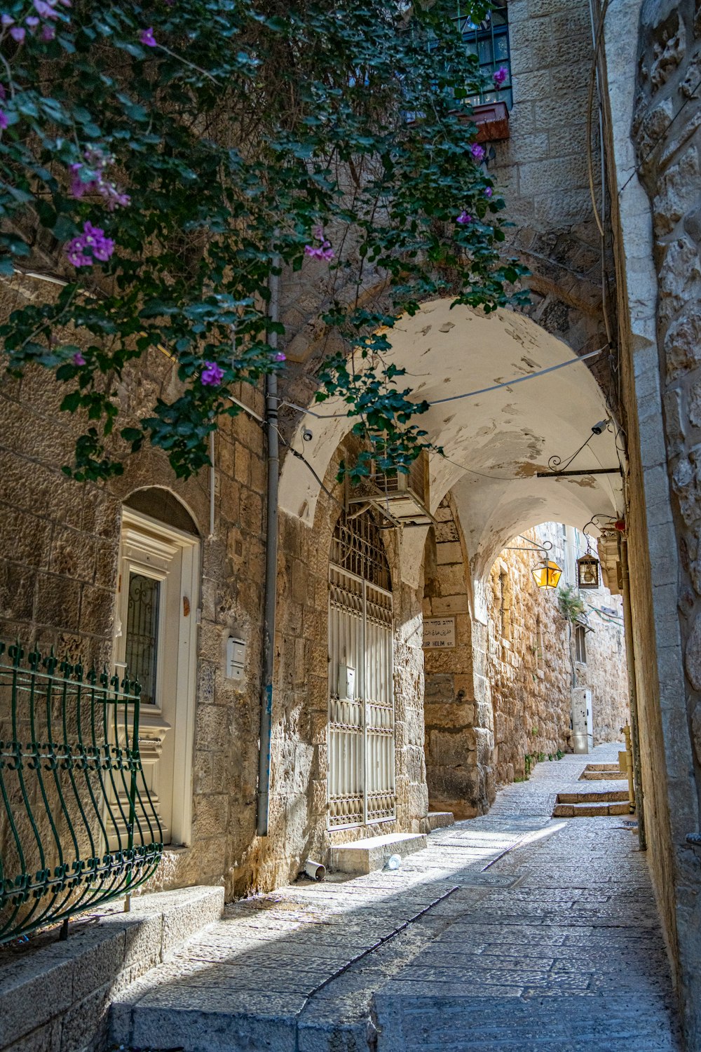 a stone building with a gate and a gate